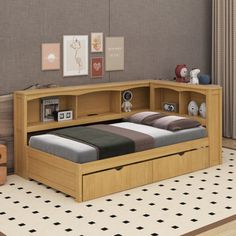 a bedroom with a bed, desk and storage drawers on the bottom shelf is shown