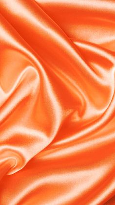 an orange satin fabric with very soft folds