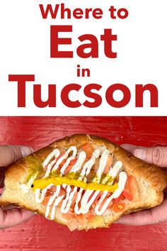 a person holding a hot dog in their hand with the words where to eat in tucson