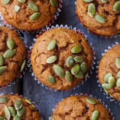 several muffins with pumpkin seeds in them