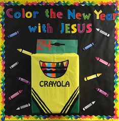 a bulletin board with crayons on it that says, color the new year with jesus