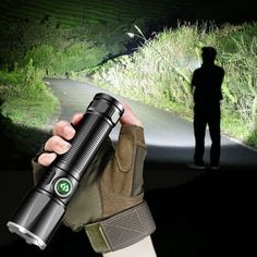 a person holding a flashlight in their hand