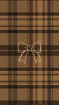 a brown and black plaid pattern with a large bow on it's back side