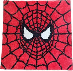 a red rug with a spiderman face on it