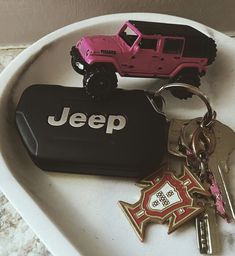 a jeep keychain with two keys on it