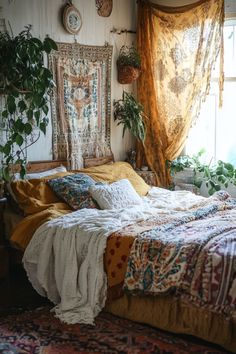 a bed sitting under a window next to a potted plant