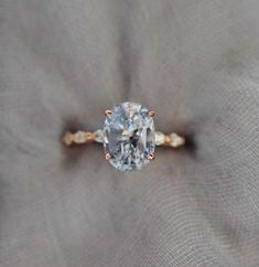 an engagement ring with a blue diamond in the center