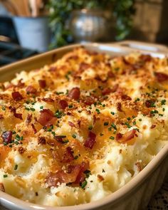 a casserole dish with bacon and cheese on top