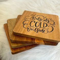 three wooden coasters with hand lettering on them