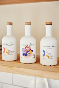 three bottles of brightland are sitting on a counter