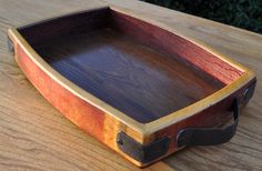 a wooden tray sitting on top of a wooden table