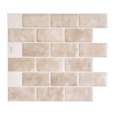 a white tile wall that is made out of different types of tiles