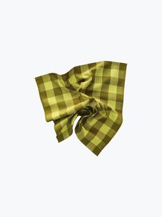 a yellow and black checkered bow on a white background