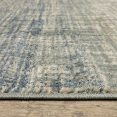 an area rug with blue and beige colors