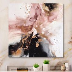 an abstract painting in pink and gold on a white wall next to a fireplace mantel