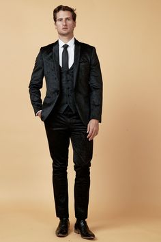 Make party wear easy with this Simon tuxedo style suit. Creating an elegant ensemble for all of those special events, this three piece is made to impress. It features a contrast satin shawl collar and embossed paisley design on the luxurious soft-to-the-touch velvet finish, a real showpiece. Model wears size 38R blazer, 38R waistcoat, 32R trousers. Features Slim fit Single-breasted Shawl lapel Single back vent Four button cuff Single button blazer fastening Waistcoat adjuster straps Complimentar Tailored Party Wear Blazer For Semi-formal Occasions, Fitted Blazer For Black-tie Festive Events, Festive Fitted Blazer For Black-tie Events, Festive Fitted Tuxedo For Black-tie Events, Tailored Sets For Black-tie Festive Events, Elegant Three-piece Suit For Festive Semi-formal Events, Elegant Three-piece Suit For Semi-formal Festive Occasions, Elegant Three-piece Suit For Festive Semi-formal Occasions, Classic Festive Party Suits