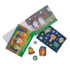 three children's books and magnets on a white background, including one with an animal theme