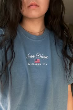 Our vintage style San Diego graphic tee is designed to fit comfortably and flatteringly on both men and women. Its lightweight and breathable material ensure all-day comfort, making it ideal for casual outings, beach strolls, or simply lounging around. Add this timeless piece to your wardrobe today and let the world know that your heart belongs to the sunny shores and vibrant culture of America's Finest City. Gen Z Fashion Trends, San Diego Vintage, Tips For Clothes, Cute Fall Fits, Graphic Tee Oversized, Gen Z Fashion, California Graphic, Clothing Website, Blue Tiger