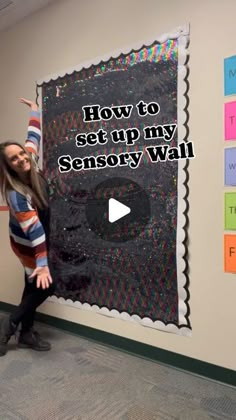 a woman standing in front of a blackboard with the words how to set up my sensory wall