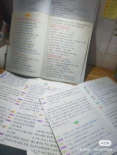 several books with chinese writing on them