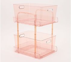 three tiered plastic storage unit with handles and drawers on each side, in front of a white background