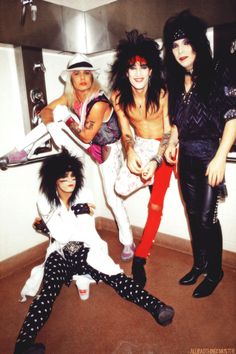 the group of people are posing together in their dressing room, dressed up for halloween