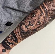 a man with a lion tattoo on his arm