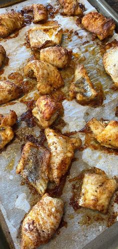 chicken wings are on a baking sheet ready to go into the oven