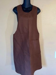 a mannequin with a brown dress on it