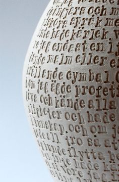 a large white vase with words written on it