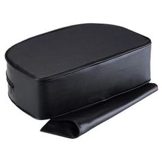 an empty black case sitting on top of a white surface with the lid open and bottom half closed