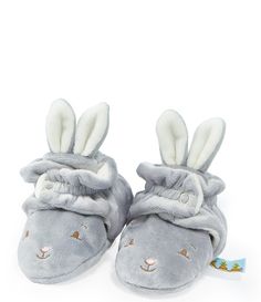 a pair of gray slippers with white bunny ears on the front and back side