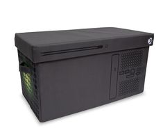 a large black box with a green light on the top and side panel is shown