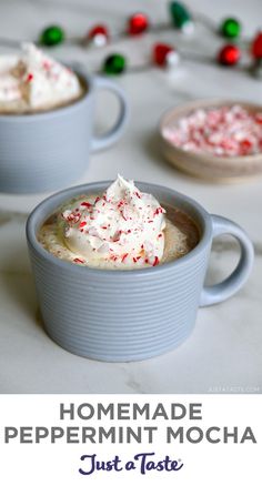 homemade peppermint mocha in two mugs with candy canes on the side