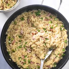 a skillet filled with rice and peas