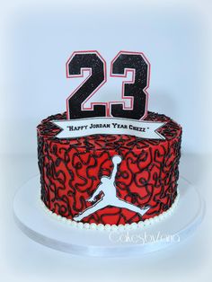 a red and black cake with the number twenty two