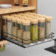 an open spice rack with spices and seasonings in it next to a counter top