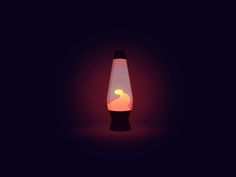 a lit up vase sitting on top of a black table next to a red light