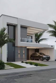 a car is parked in front of a modern house that has palm trees and landscaping