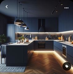 an image of a modern kitchen setting with blue cabinets and wood flooring in the background