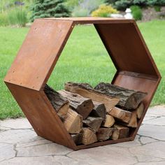 a wooden firewood holder sitting on top of a stone walkway