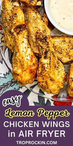 lemon pepper chicken wings in air fryer with dipping sauce on the side and text overlay that reads easy lemon pepper chicken wings in air fryer