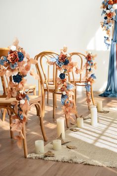 the chairs are decorated with flowers and candles