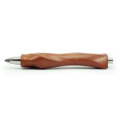 a wooden pen with a metal tip sitting on top of it