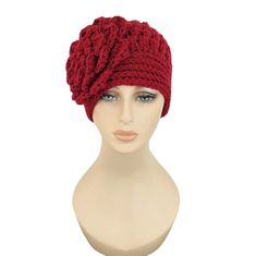 a mannequin head wearing a red knitted hat