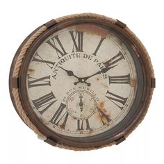 an old clock with roman numerals and rope around the face on a white background