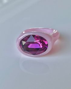 Big oval magenta purple crystal  in a chunky bold style artisan handcrafted polymer clay ring The stone is accompanied by soft glowy pink shiny color   For those who love purple pink color palette its a dream piece Hand crafted with attention to details Polymer clay is a string material so it will not break easily unlike other materials it is quite durable and the gloss prevents it from scratches and makes it looks gorgeous Purple Pink Color Palette, Fimo Ring, Pink Rings, Clay Ring, Polymer Clay Ring, Purple Pink Color, Magenta Purple, Color Palette Pink, Pink Bubbles