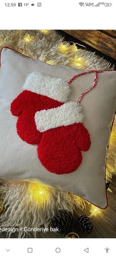 a red and white pillow with a santa hat on it