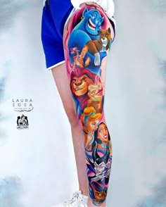 this is an image of a woman's leg with disney characters on it