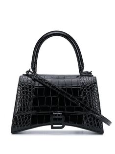 black leather single rounded top handle adjustable detachable shoulder strap embossed crocodile effect foldover top with magnetic fastening internal logo stamp main compartment internal zip pocket B logo to the front back slip pocket Balenciaga Tote, Latest Handbags, Balenciaga Handbags, B Logo, Womens Designer Bags, Balenciaga Black, Black Leather Handbags, Balenciaga Bag, Logo Stamp